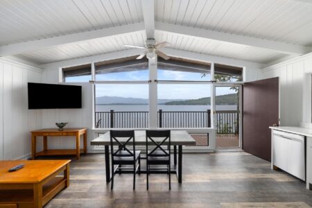 A kitchen and dining area with a view of the lake at a Lake George resort.
