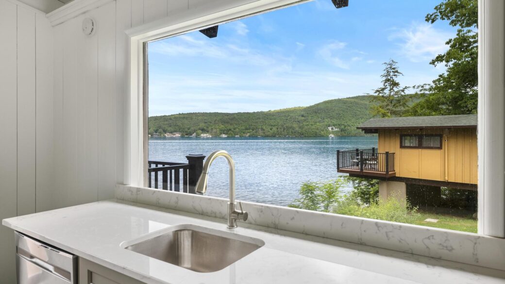 A Lake George resort with a kitchen and a window overlooking the lake.
