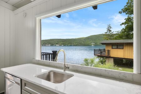 A Lake George resort with a kitchen and a window overlooking the lake.