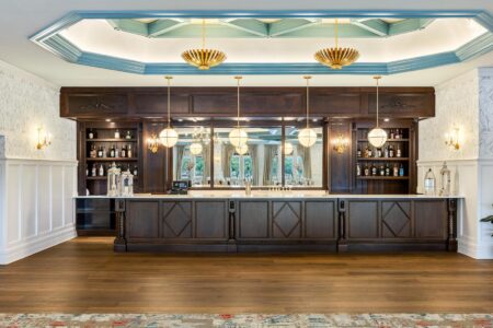 A Lake George vacation home features a bar with a blue ceiling.