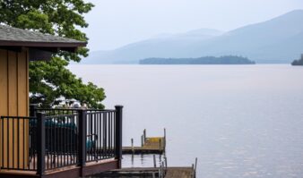A Lake George resort with a deck overlooking the water.
