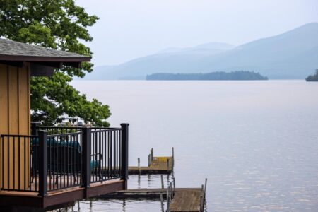 A Lake George resort with a deck overlooking the water.