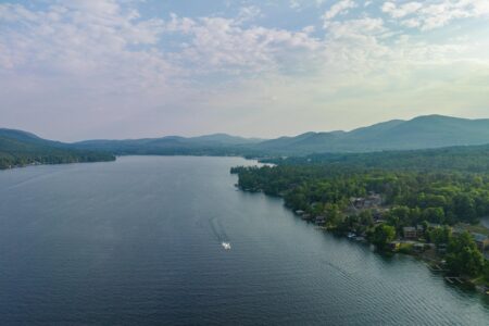 Aerial view of Lake George with a boat.