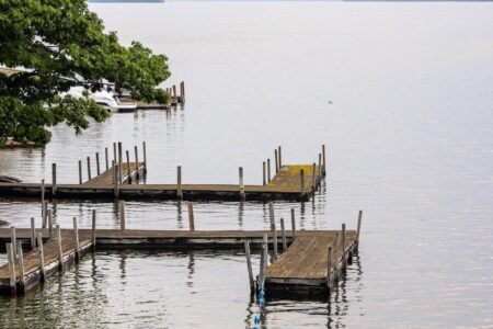 A boat dock in Lake George with a boat