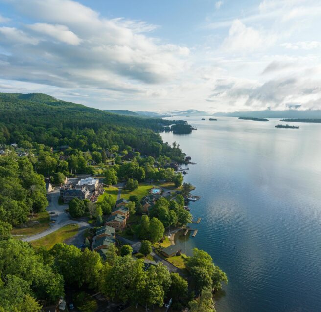 An aerial view of a town located by Lake George.