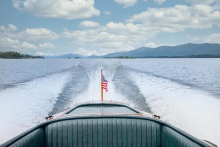 A Lake George resort showcasing the back of a boat adorned with an American flag