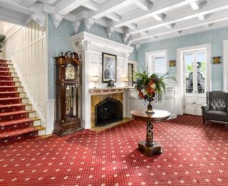 A living room with a red carpet in the Lake George resort.