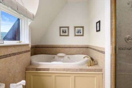 Lake George lodging with a jacuzzi tub in the bathroom.