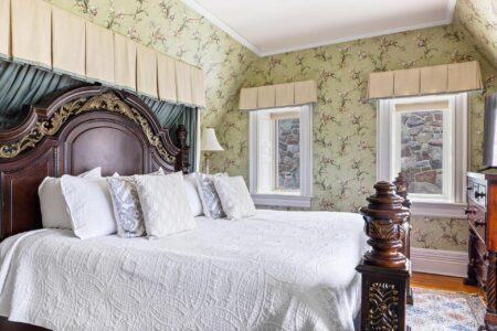 Lake George lodging with floral wallpaper in bedroom.