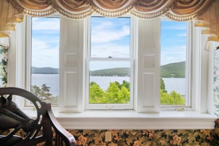 A Lake George lodging with a large window overlooking Erlowest
