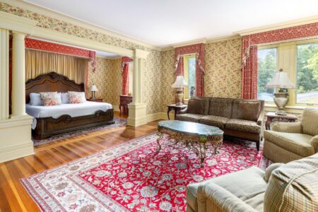 An ornately decorated bedroom in one of the best hotels in Lake George.