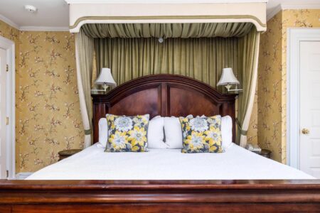 A canopy bed in one of the best Lake George hotels.