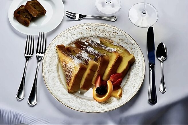 Gourmet French toast breakfast at The Inn at Erlowest in Lake George, served on a beautifully set table.